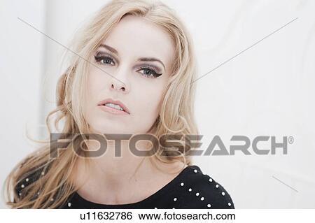 Close up of womans serious face View Large Photo Image Stock Photograph - Close up of womans serious face. Fotosearch