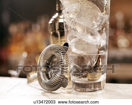 Stock Image - Cocktail making tools on bar. Fotosearch