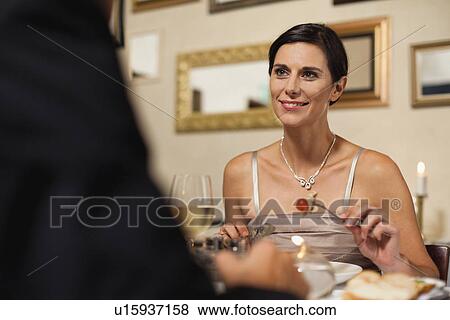 Stock Photo - Couple having dinner in restaurant. Fotosearch