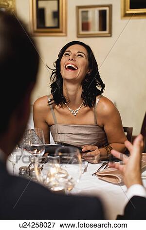 Couple having dinner in restaurant View Large Photo Image Stock Photo - Couple having dinner in restaurant. Fotosearch