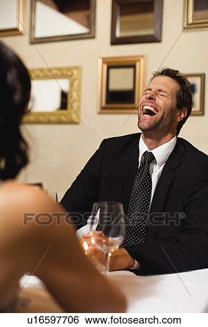 Stock Photograph - Couple having dinner in restaurant. Fotosearch