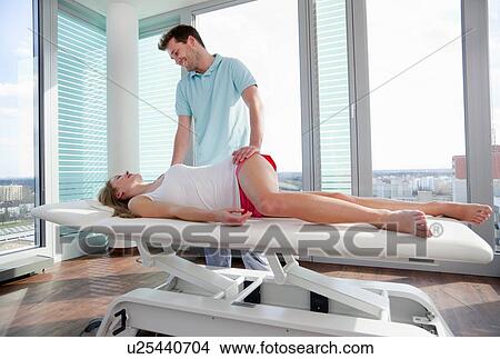 Doctor examining woman in office View Large Photo Image Picture - Doctor examining woman in office. Fotosearch