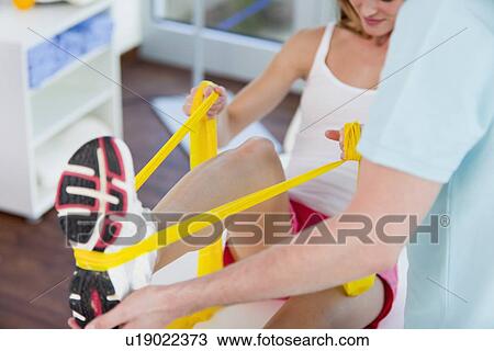 Doctor examining womans legs in office View Large Photo Image Stock Image - Doctor examining womans legs in office. Fotosearch
