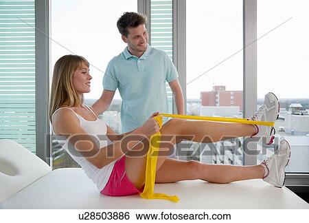 Doctor examining womans legs in office View Large Photo Image Stock Photograph - Doctor examining womans legs in office. Fotosearch