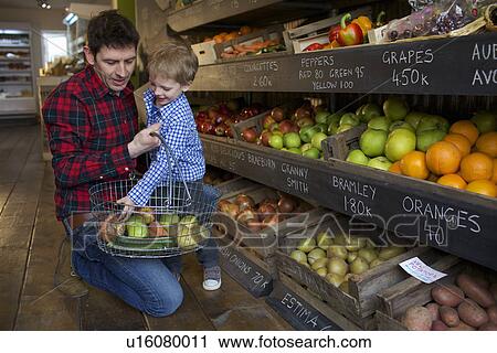 Father and son buying produce in store View Large Photo Image Stock Image - Father and son buying produce in store. Fotosearch