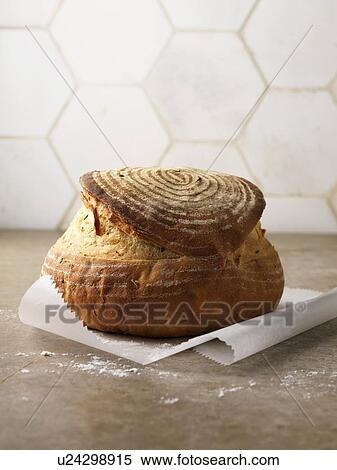 Freshly baked bread in paper View Large Photo Image Stock Photography - Freshly baked bread in paper. Fotosearch