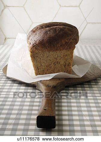 Freshly baked bread on wooden paddle View Large Photo Image Stock Photo - Freshly baked bread on wooden paddle. Fotosearch