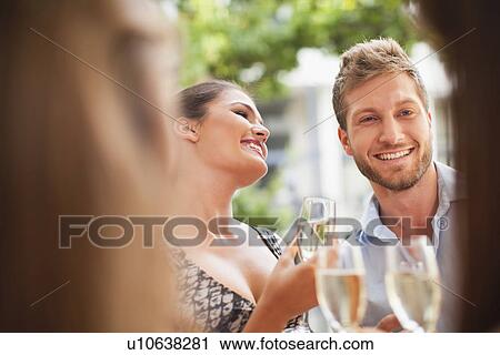 Friends drinking champagne together View Large Photo Image Stock Image - Friends drinking champagne together. Fotosearch