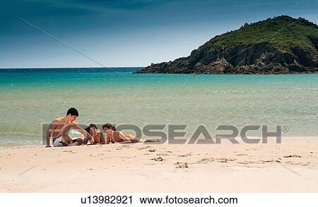 Friends relaxing on sandy beach View Large Photo Image Stock Image - Friends relaxing on sandy beach. Fotosearch