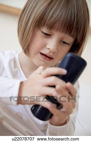 Girl dialing number on telephone View Large Photo Image Stock Photo - Girl dialing number on telephone. Fotosearch