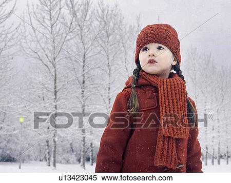 Stock Photography - Girl walking in snow. Fotosearch