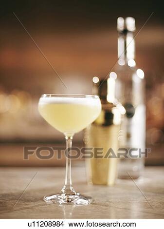 Glass of fruity cocktail on bar View Large Photo Image Picture - Glass of fruity cocktail on bar. Fotosearch