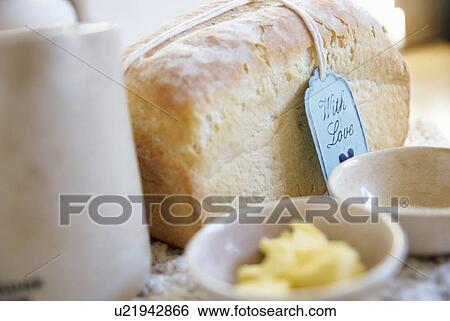 Loaf of bread with butter and salt View Large Photo Image Stock Photograph - Loaf of bread with butter and salt. Fotosearch