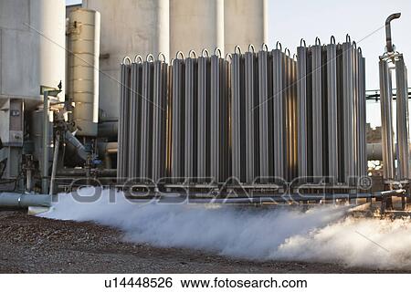 Machinery and smoke at oil refinery View Large Photo Image Stock Photograph - Machinery and smoke at oil refinery. Fotosearch