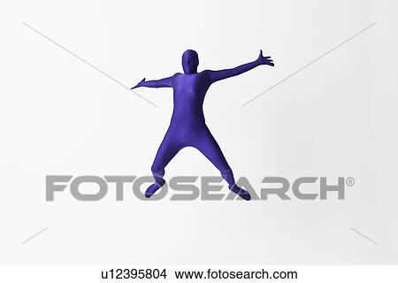 Picture - Man in bodysuit jumping for joy. Fotosearch