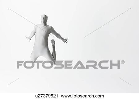Stock Image - Man in bodysuit jumping. Fotosearch