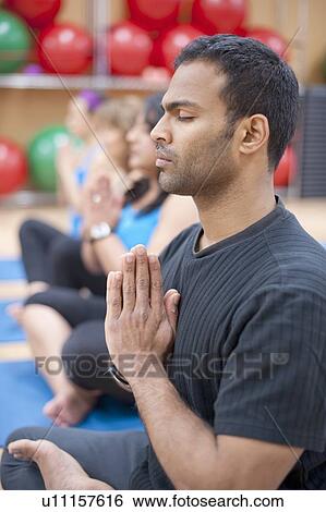 Man practicing yoga in studio View Large Photo Image Stock Photograph - Man practicing yoga in studio. Fotosearch