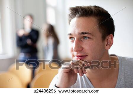Man resting chin in hand View Large Photo Image Stock Photography - Man resting chin in hand. Fotosearch