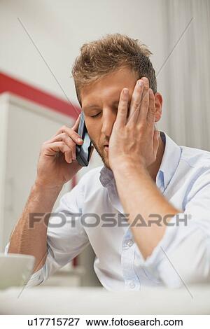 Man talking on cell phone at breakfast View Large Photo Image Stock Photo - Man talking on cell phone at breakfast. Fotosearch