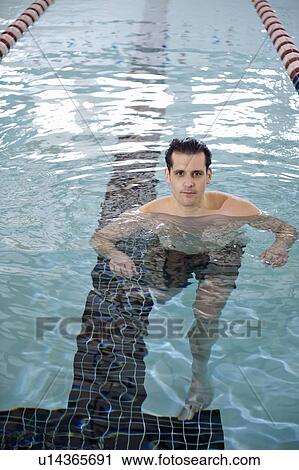 Man treading water in swimming pool View Large Photo Image Stock Image - Man treading water in swimming pool. Fotosearch
