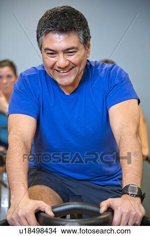 Man using spin machine in gym View Large Photo Image Picture - Man using spin machine in gym. Fotosearch