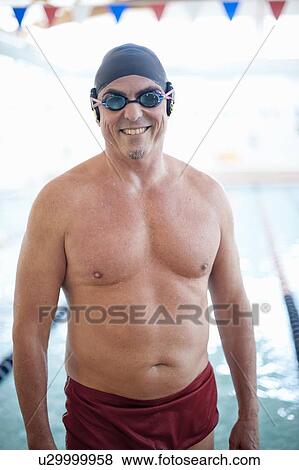 Man wearing swim gear at pool View Large Photo Image Stock Photo - Man wearing swim gear at pool. Fotosearch