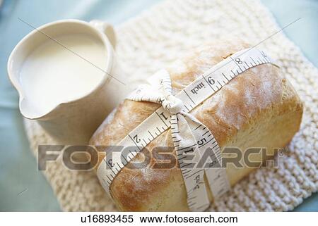 Measuring tape on fresh baked bread View Large Photo Image Stock Photography - Measuring tape on fresh baked bread. Fotosearch