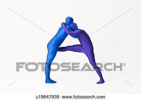 Stock Photo - Men in bodysuits making the letter A. Fotosearch