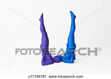 Stock Image - Men in bodysuits making the letter U. Fotosearch