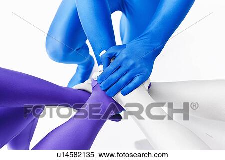 Stock Photography - Men in bodysuits posing together. Fotosearch