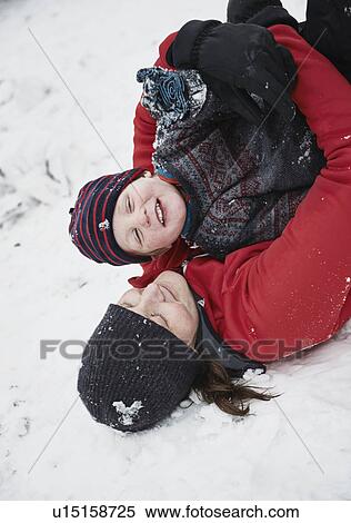 Mother and son playing in snow View Large Photo Image Stock Photography - Mother and son playing in snow. Fotosearch