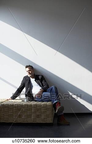 Older man having cup of coffee on bench View Large Photo Image Stock Image - Older man having cup of coffee on bench. Fotosearch