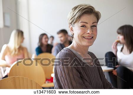 Older student smiling in classroom View Large Photo Image Stock Image - Older student smiling in classroom. Fotosearch