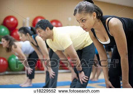 People practicing yoga in studio View Large Photo Image Stock Image - People practicing yoga in studio. Fotosearch