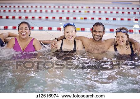 People relaxing in swimming pool View Large Photo Image Picture - People relaxing in swimming pool. Fotosearch