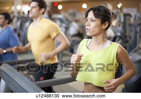 People using treadmills in gym View Large Photo Image Stock Image - People using treadmills in gym. Fotosearch