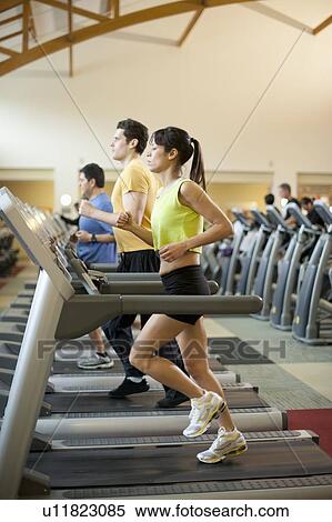 People using treadmills in gym View Large Photo Image Stock Photography - People using treadmills in gym. Fotosearch