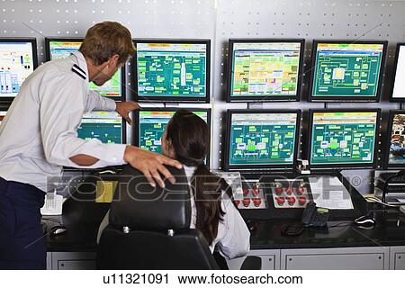 People working in security control room View Large Photo Image Stock Image - People working in security control room. Fotosearch