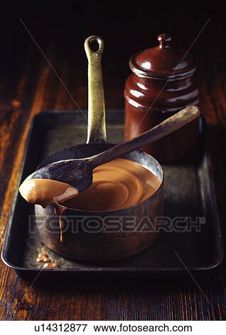 Pot of caramel sauce on tray View Large Photo Image Stock Photo - Pot of caramel sauce on tray. Fotosearch