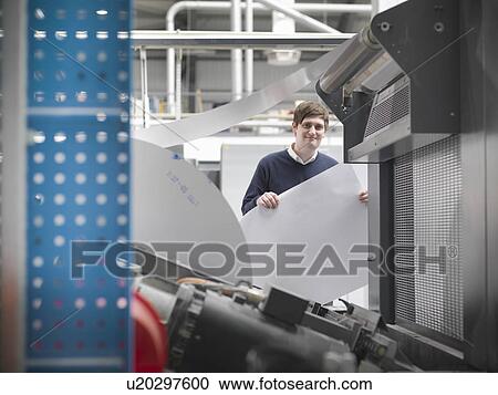 Printer holding paper at press View Large Photo Image Stock Image - Printer holding paper at press. Fotosearch