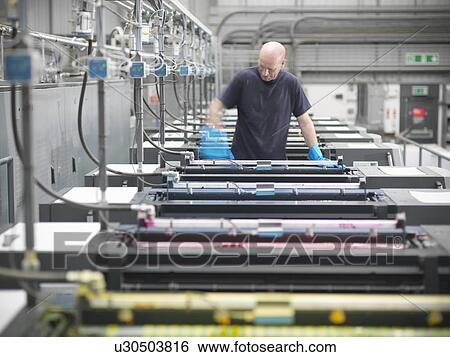 Printer inking printing press in shop View Large Photo Image Stock Photograph - Printer inking printing press in shop. Fotosearch