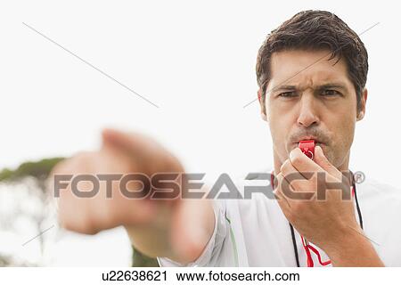 Referee blowing whistle in game View Large Photo Image Stock Image - Referee blowing whistle in game. Fotosearch