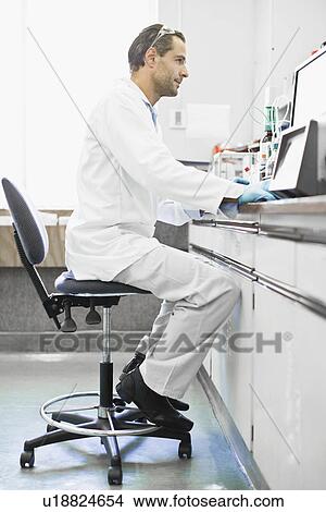 Scientist using computer in lab View Large Photo Image Picture - Scientist using computer in lab. Fotosearch