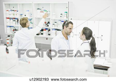 Scientists talking in lab View Large Photo Image Stock Image - Scientists talking in lab. Fotosearch