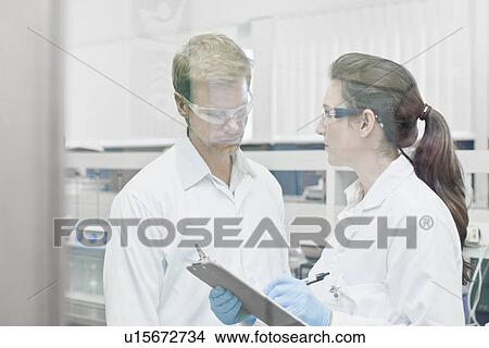 Scientists working together in lab View Large Photo Image Picture - Scientists working together in lab. Fotosearch