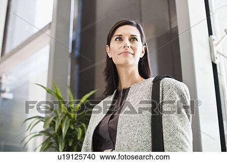 Stock Image - Smiling businesswoman. Fotosearch