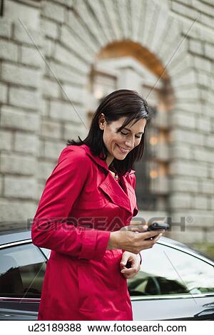 Smiling woman talking on cell phone View Large Photo Image Stock Photo - Smiling woman talking on cell phone. Fotosearch