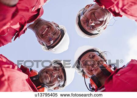 Smiling workers posing outdoors View Large Photo Image Stock Photography - Smiling workers posing outdoors. Fotosearch