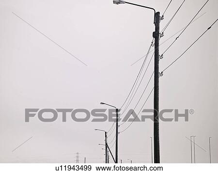 Street lights in snowy landscape View Large Photo Image Stock Photo - Street lights in snowy landscape. Fotosearch