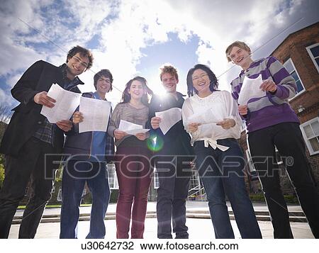 Students reading grades together View Large Photo Image Stock Image - Students reading grades together. Fotosearch